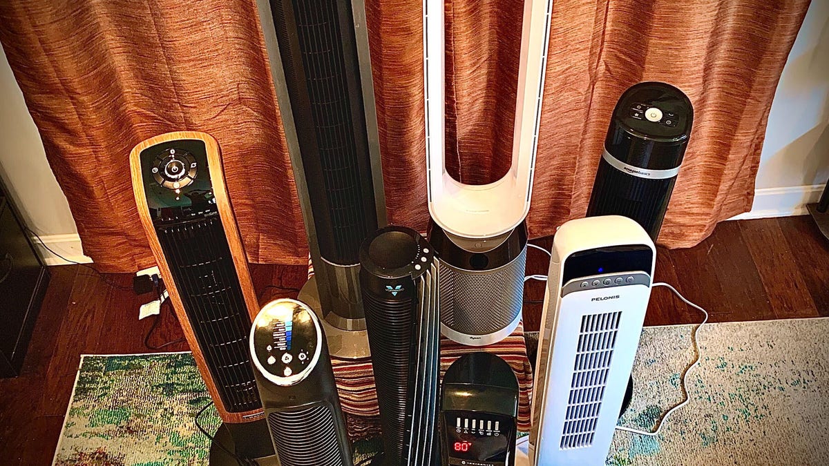 A black and orange Lasko tower fan.